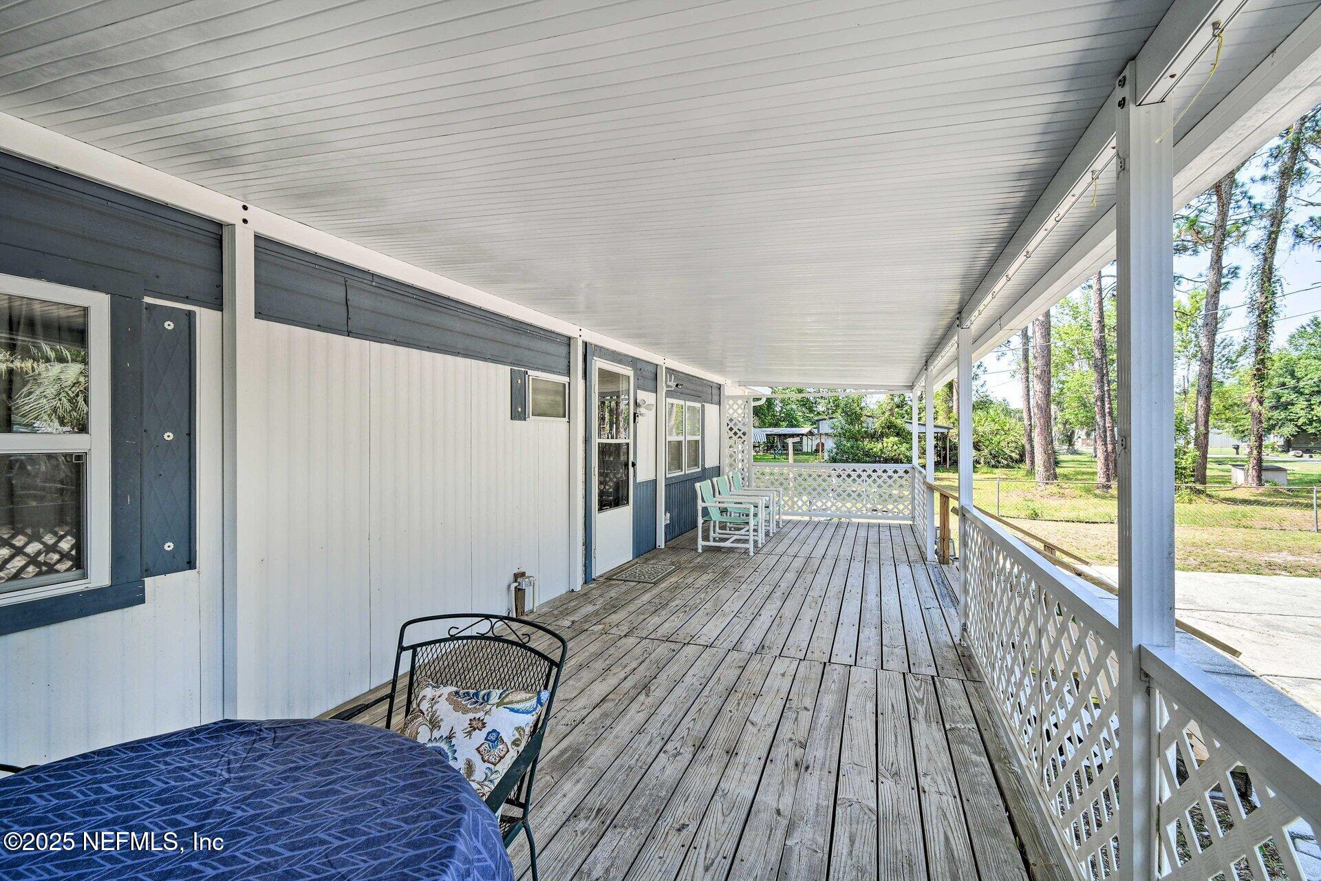 118 Riverside Avenue Satsuma, FL 32189 - Photo 2 of 27 a view of balcony with wooden floor