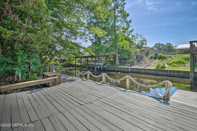 a view of deck with chairs and wooden floor