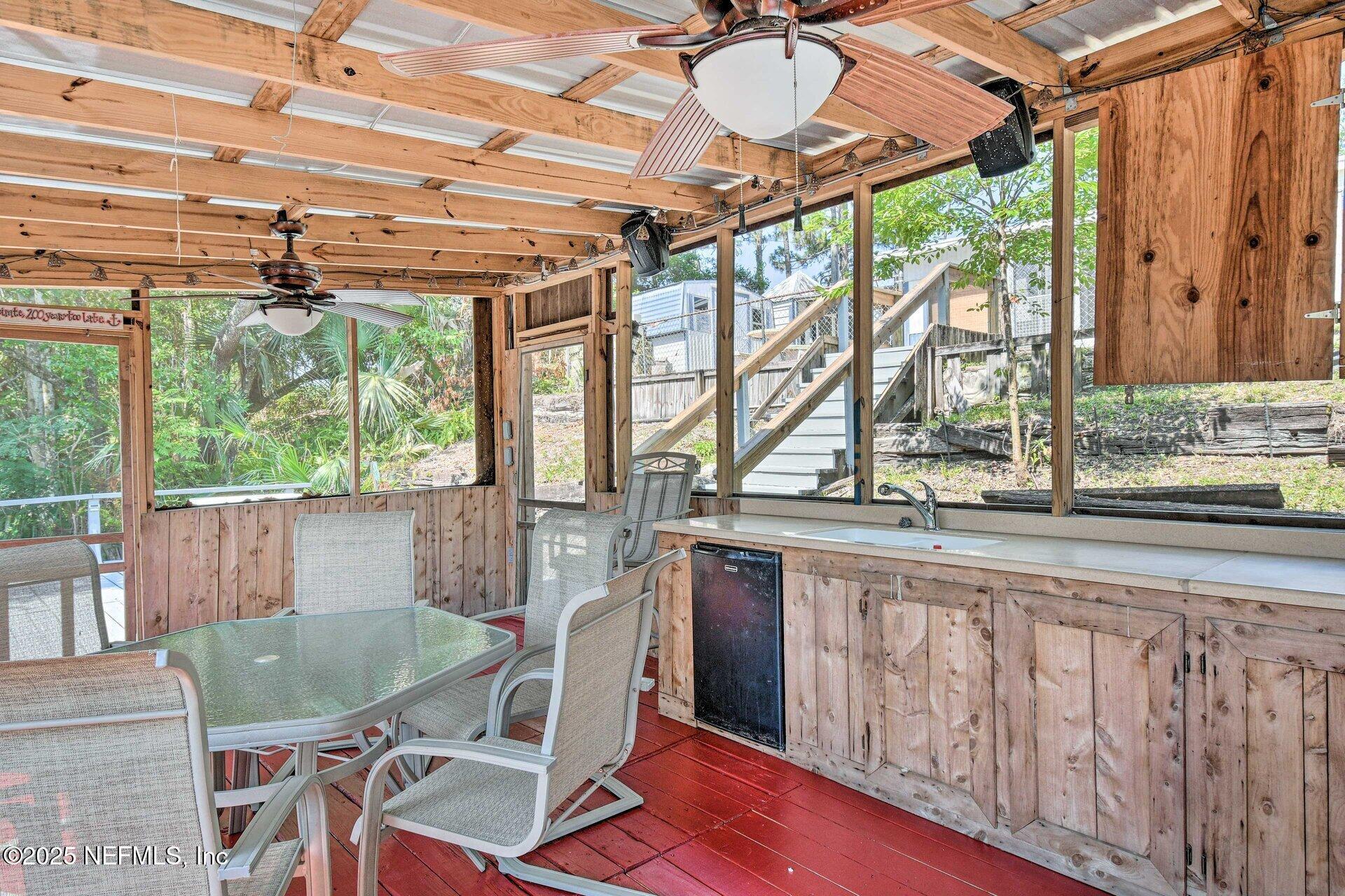 118 Riverside Avenue Satsuma, FL 32189 - Photo 23 of 27 a view of a dining room with furniture window and outside view