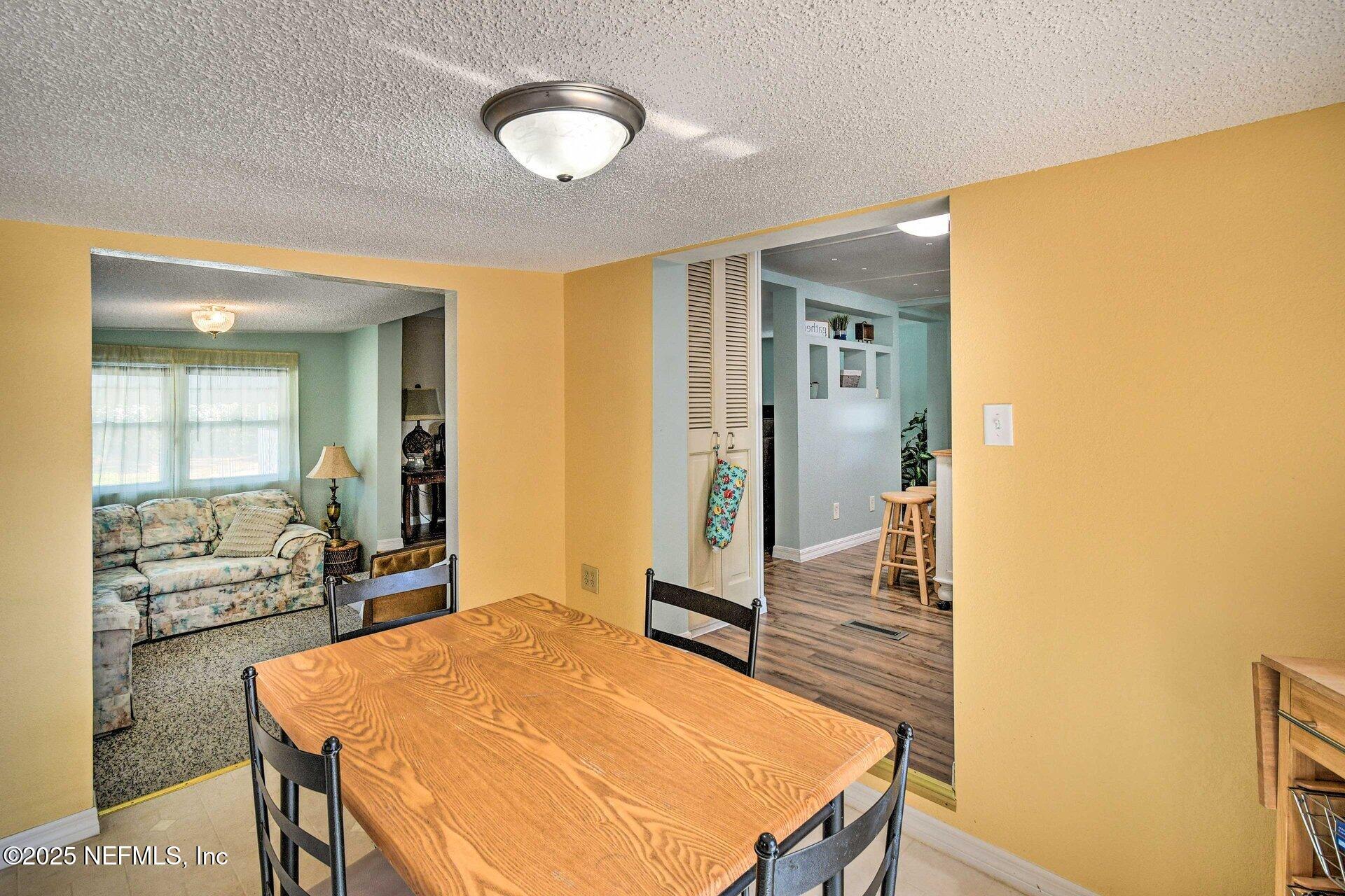 118 Riverside Avenue Satsuma, FL 32189 - Photo 9 of 27 a room with a table and chairs