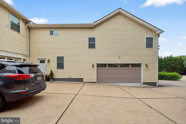 a view of a car park in front of house