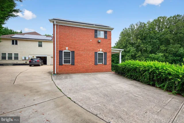a front view of a house with yard
