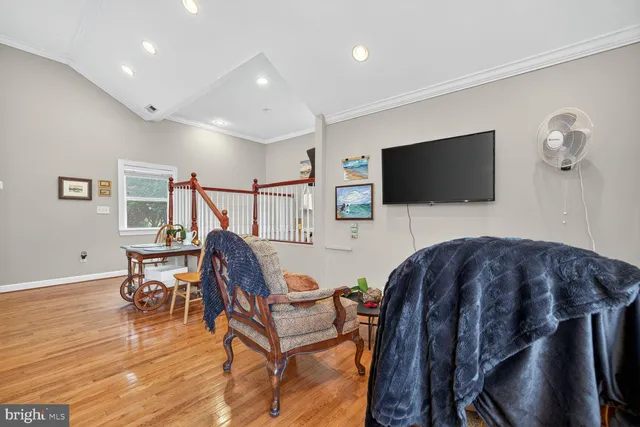 a view of a livingroom with furniture and a flat screen tv