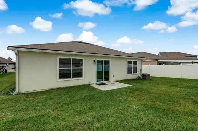a house that has sitting area in front of it
