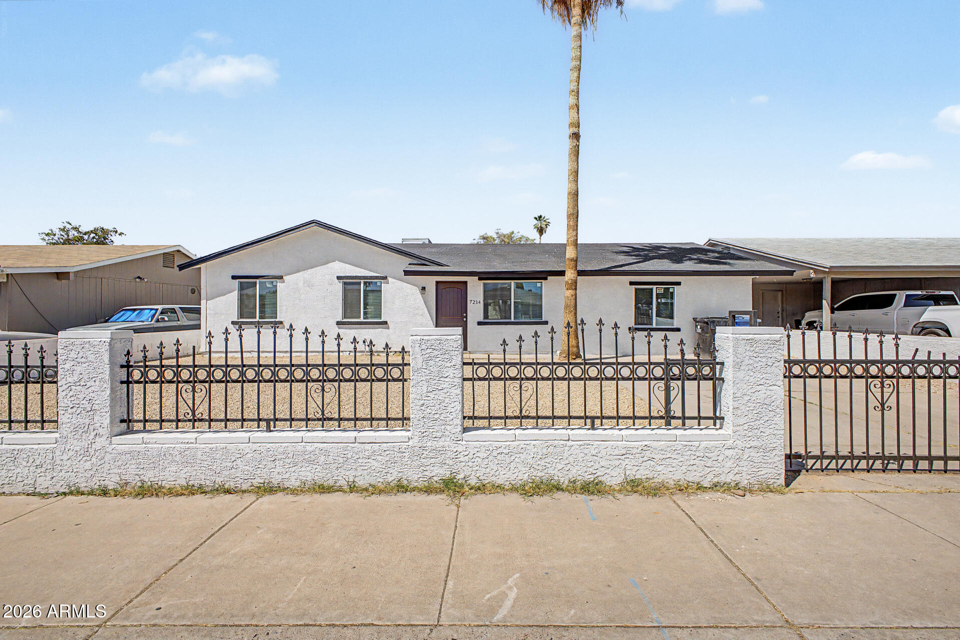 a view of a house with a fence