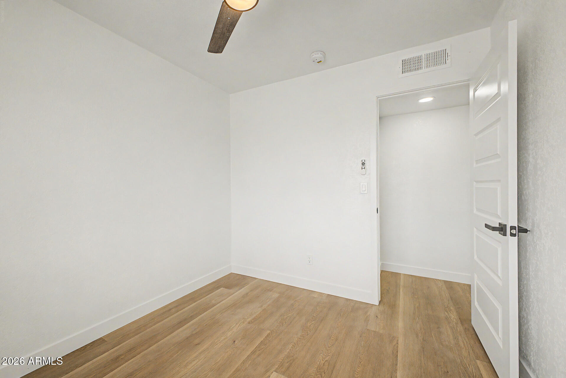 7214 West Flower Street Phoenix, AZ 85033 - Photo 18 of 29 a view of a room with wooden floor