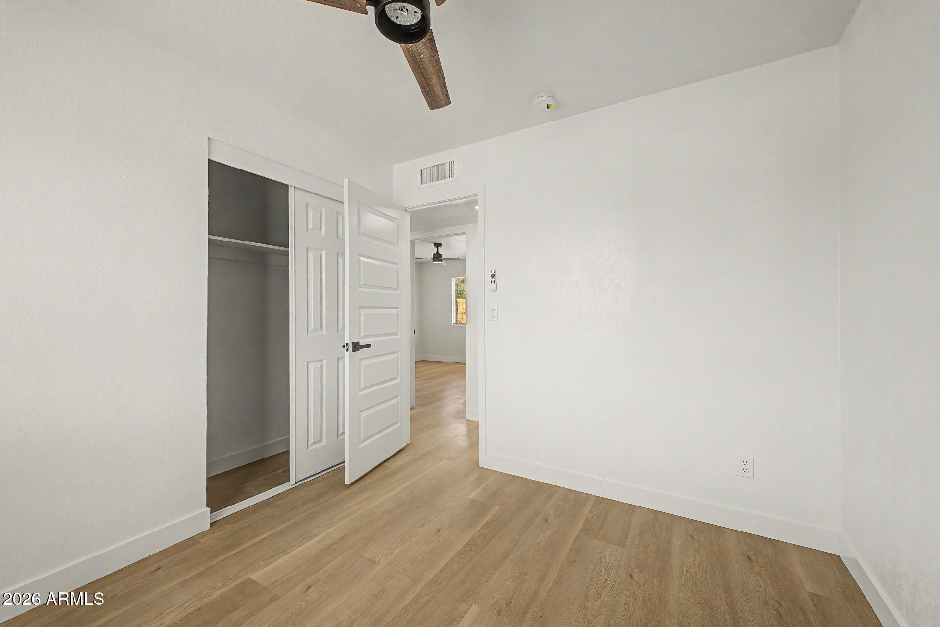 7214 West Flower Street Phoenix, AZ 85033 - Photo 21 of 29 a view of a room with wooden floor