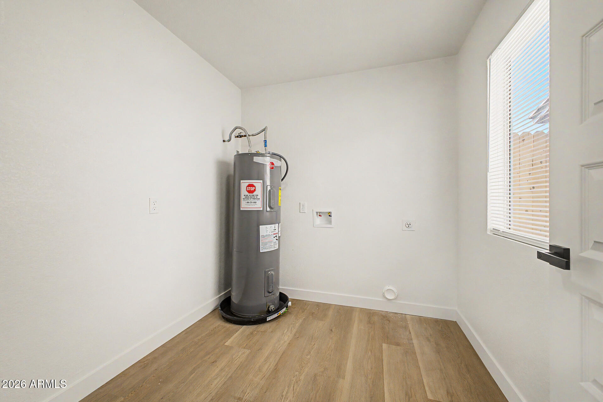 7214 West Flower Street Phoenix, AZ 85033 - Photo 24 of 29 a view of empty room with windows