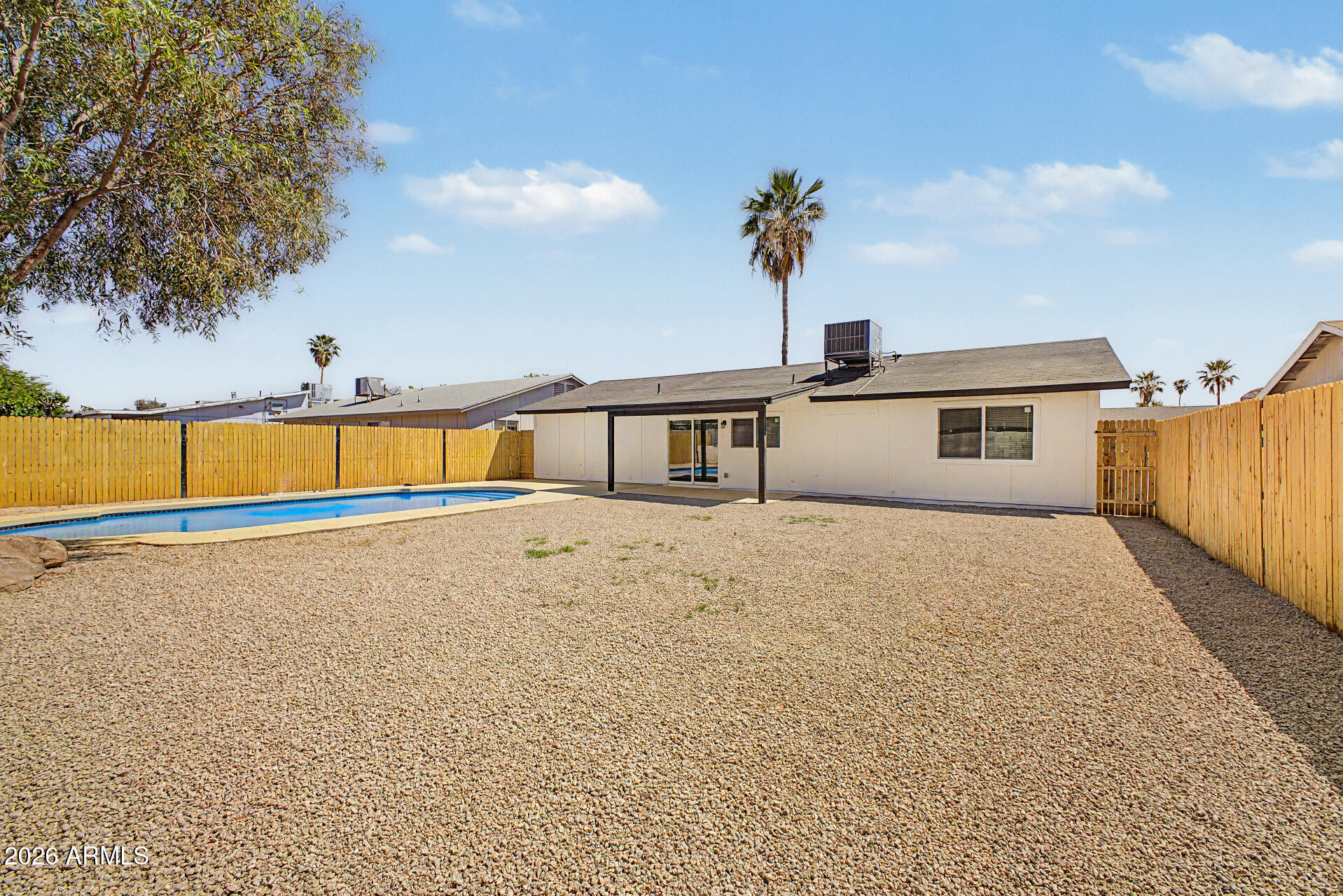 7214 West Flower Street Phoenix, AZ 85033 - Photo 28 of 29 a front view of a house with a road