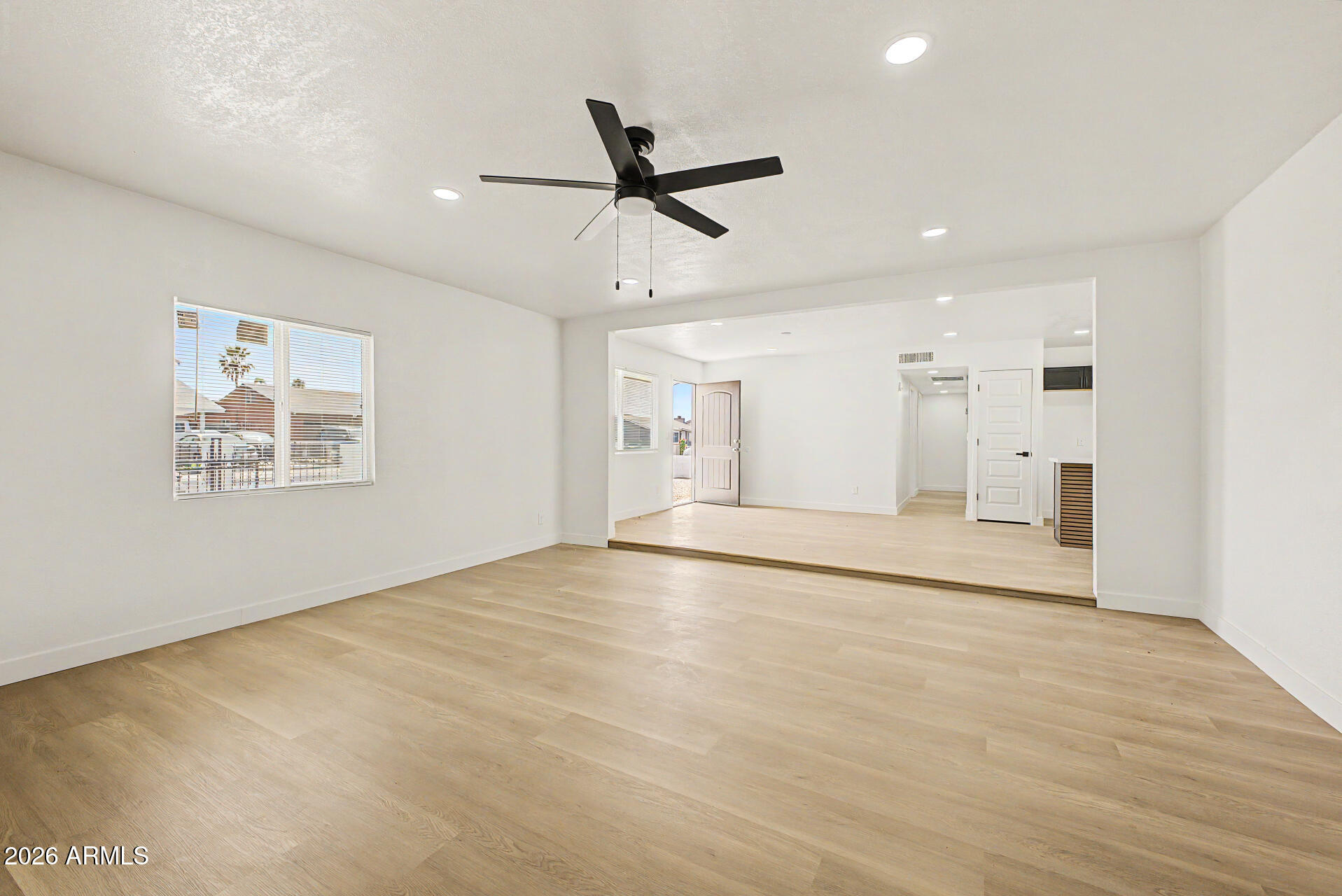 7214 West Flower Street Phoenix, AZ 85033 - Photo 6 of 29 a view of an empty room with a window