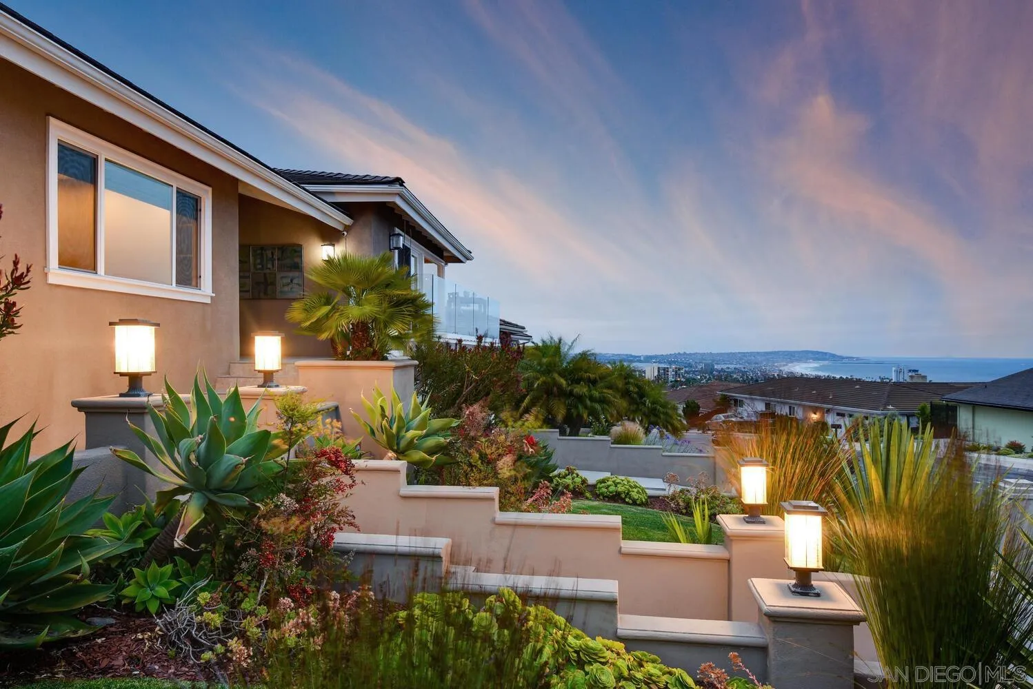5459 Moonlight Lane La Jolla, CA 92037 - Photo 11 of 42 a view of a chair and tables in patio of the house