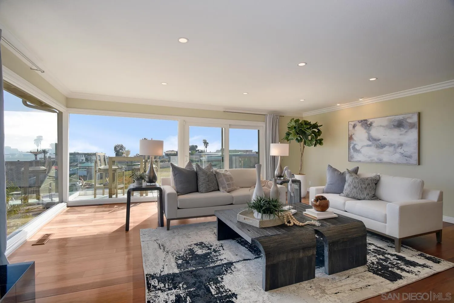 5459 Moonlight Lane La Jolla, CA 92037 - Photo 23 of 42 a living room with furniture and a floor to ceiling window
