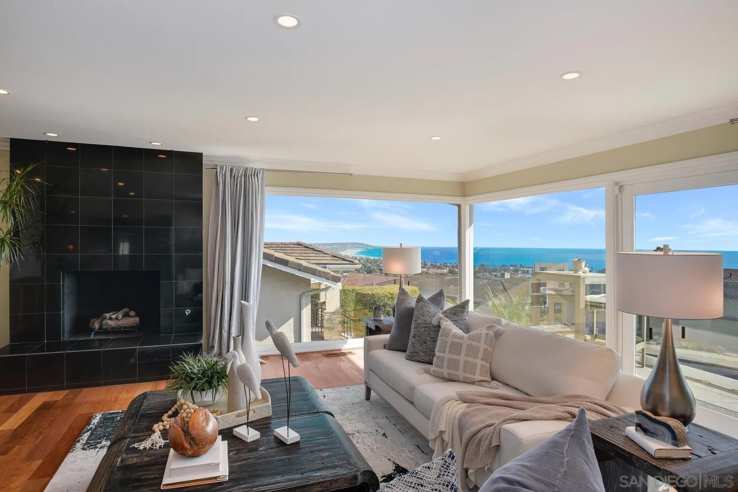 5459 Moonlight Lane La Jolla, CA 92037 - Photo 24 of 42 a living room with furniture and a fireplace