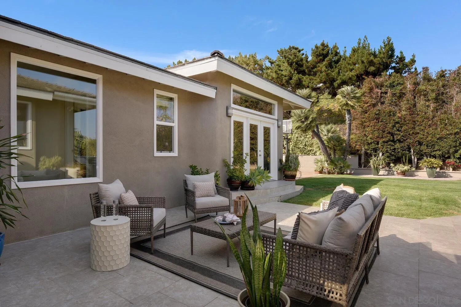 5459 Moonlight Lane La Jolla, CA 92037 - Photo 29 of 42 a view of a patio with couches chairs and a fire pit