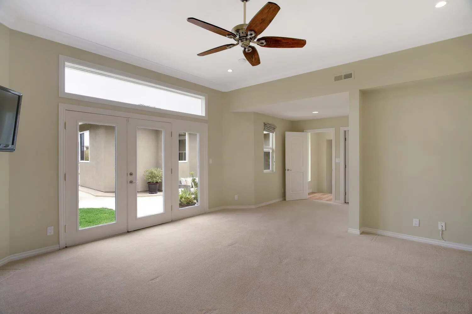 5459 Moonlight Lane La Jolla, CA 92037 - Photo 40 of 42 a view of a livingroom with a ceiling fan and windows