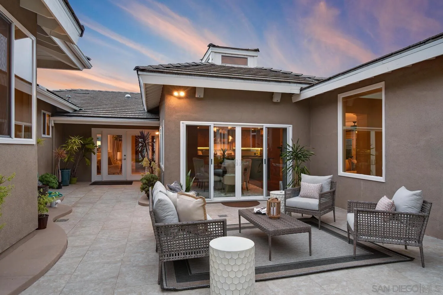 5459 Moonlight Lane La Jolla, CA 92037 - Photo 9 of 42 a view of a patio with couches table and chairs and potted plants