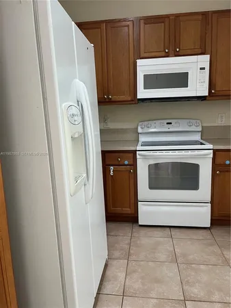 a kitchen with a stove and a microwave