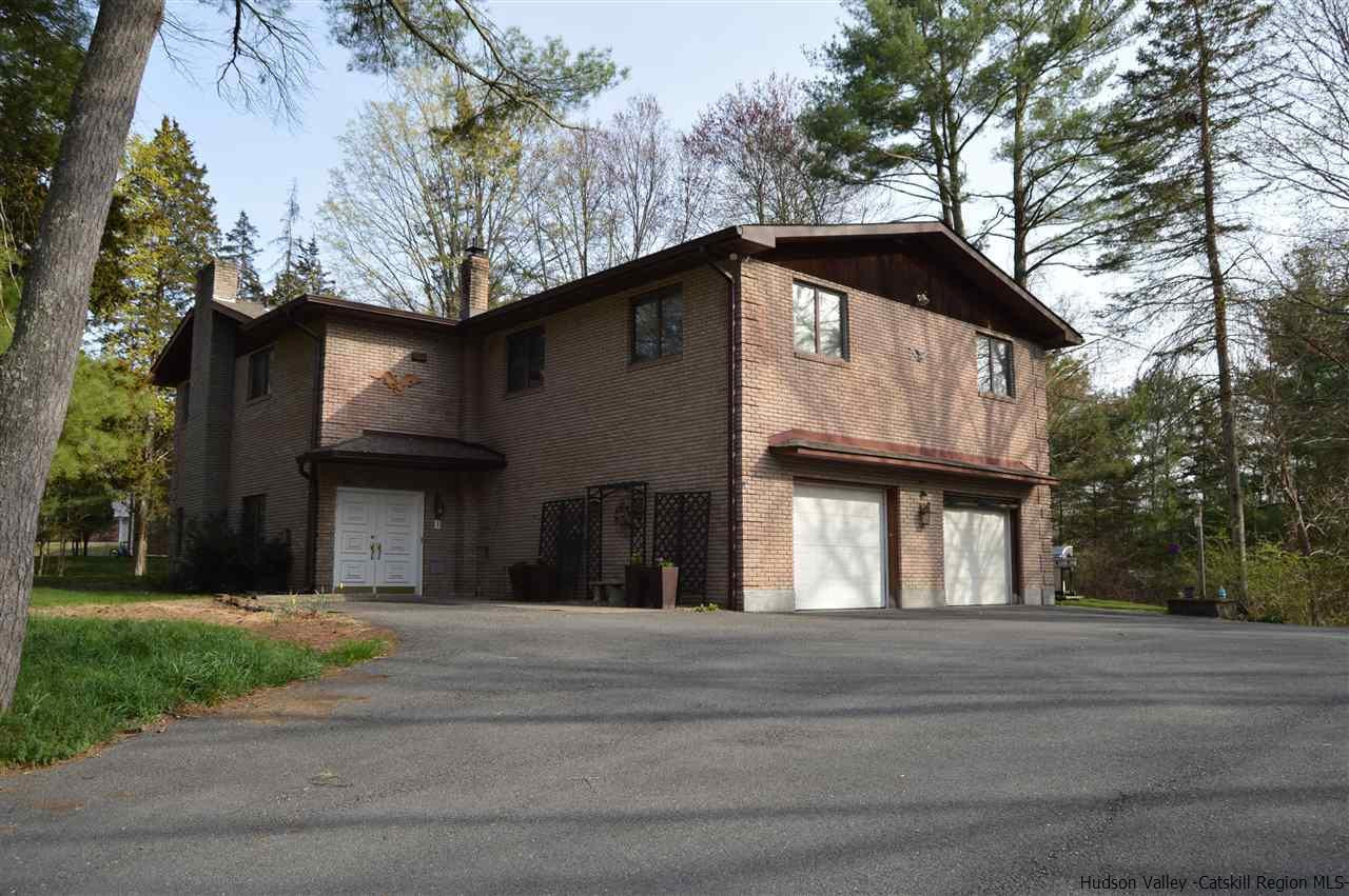 a tall building with large trees