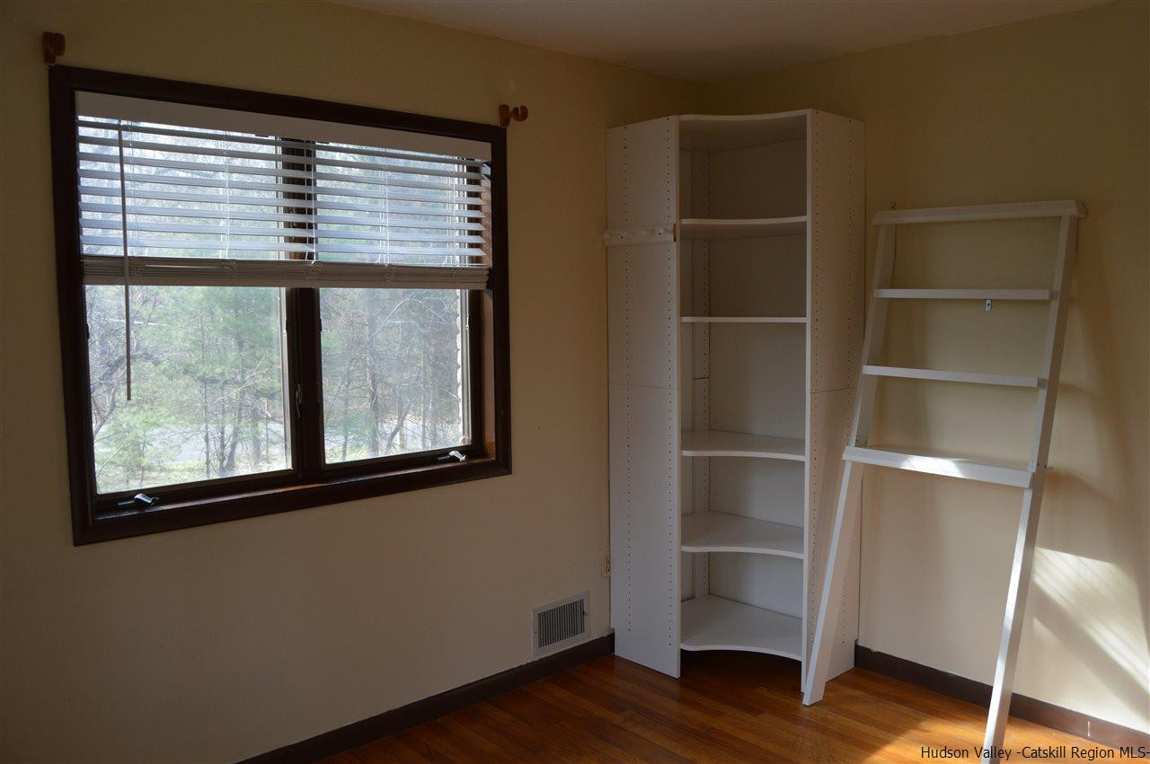 8 Skytop Drive Kingston, NY 12401 - Photo 13 of 23 a view of a room with wooden floor and a window