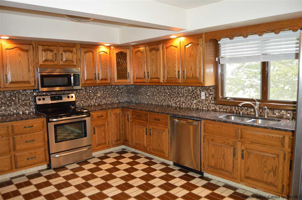 8 Skytop Drive Kingston, NY 12401 - Photo 4 of 23 a kitchen with stainless steel appliances a sink stove and microwave