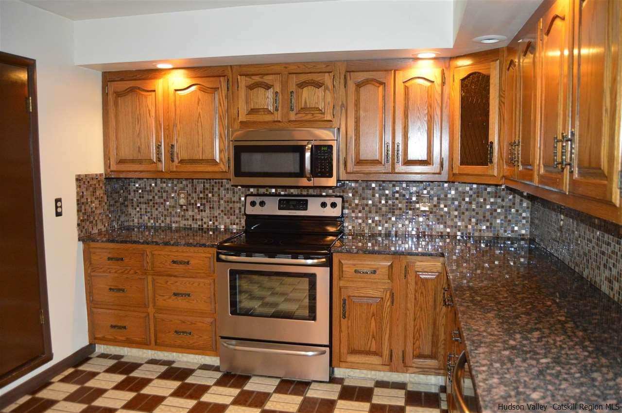 8 Skytop Drive Kingston, NY 12401 - Photo 5 of 23 a kitchen with stainless steel appliances a stove a sink and a microwave