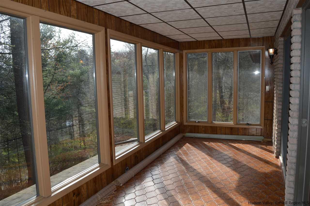 8 Skytop Drive Kingston, NY 12401 - Photo 8 of 23 a view of empty room with wooden floor and fan