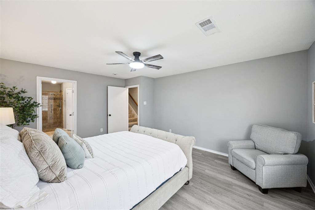 621 Renaissance Place Cedar Hill, TX 75104 - Photo 13 of 28 a bedroom with a bed and a couch