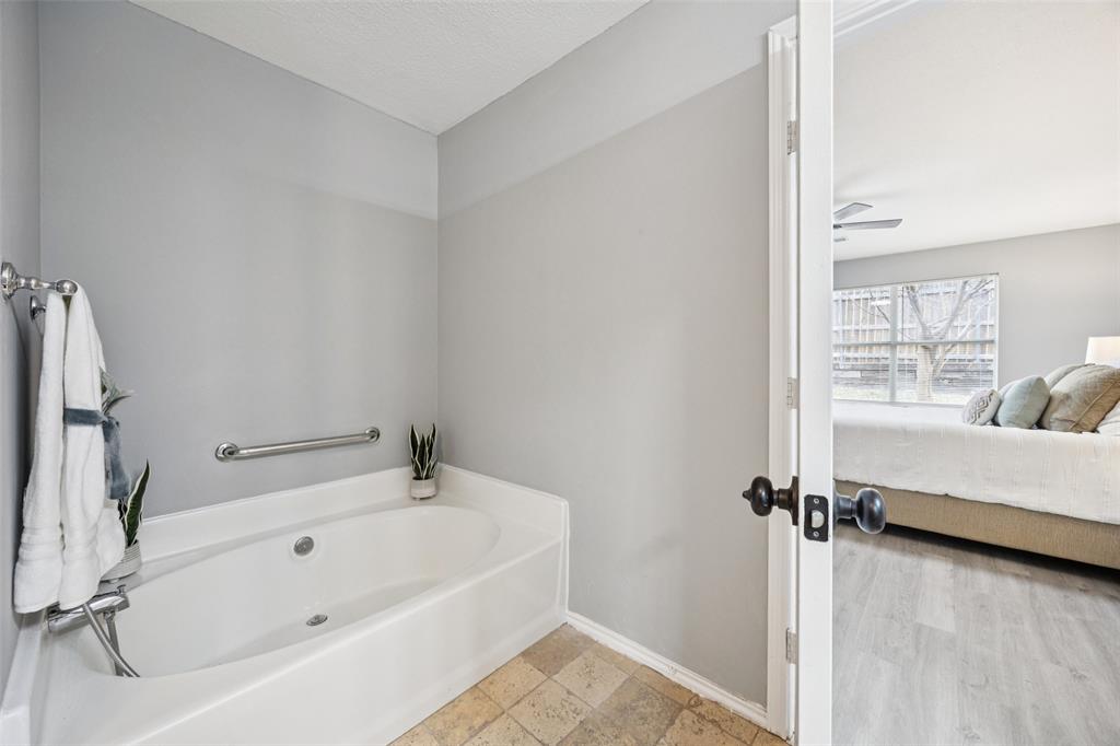 621 Renaissance Place Cedar Hill, TX 75104 - Photo 16 of 28 a white bath tub sitting next to a window