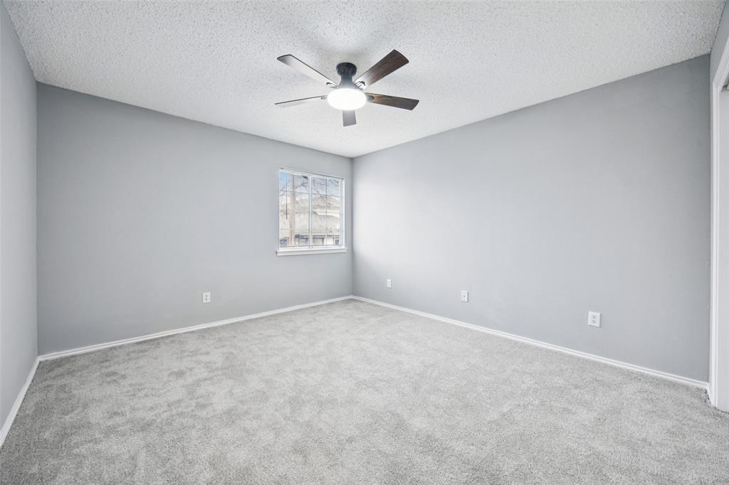 621 Renaissance Place Cedar Hill, TX 75104 - Photo 18 of 28 an empty room with windows and ceiling fan