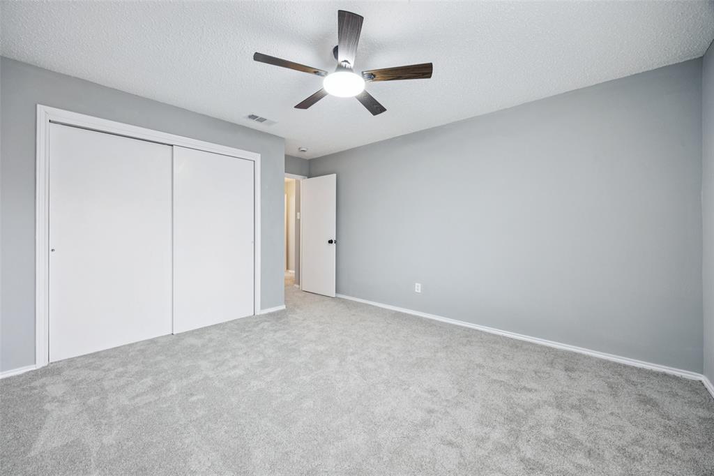 621 Renaissance Place Cedar Hill, TX 75104 - Photo 21 of 28 an empty room with closet and fan