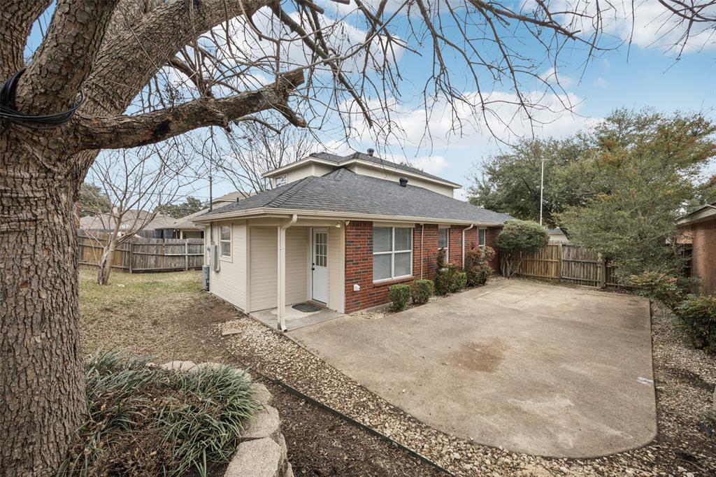 621 Renaissance Place Cedar Hill, TX 75104 - Photo 25 of 28 a front view of a house with a yard and trees