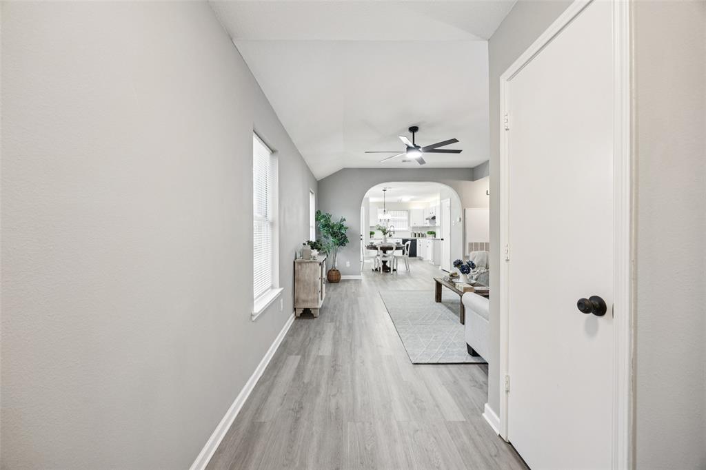 621 Renaissance Place Cedar Hill, TX 75104 - Photo 3 of 28 a view of a hallway with wooden floor and furniture