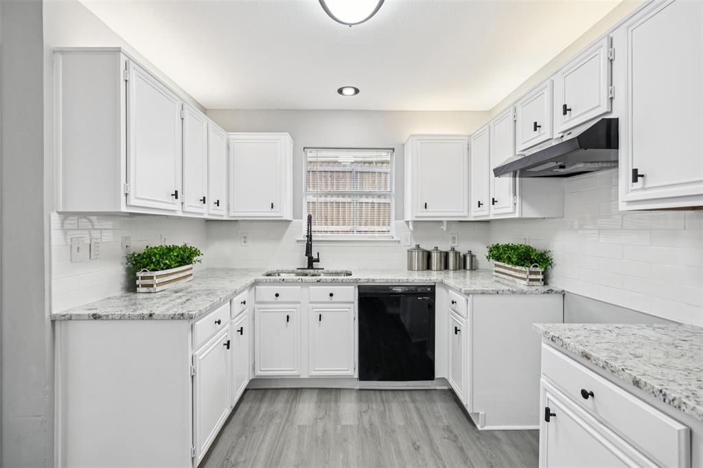 621 Renaissance Place Cedar Hill, TX 75104 - Photo 7 of 28 a kitchen with stainless steel appliances granite countertop a stove sink and cabinets