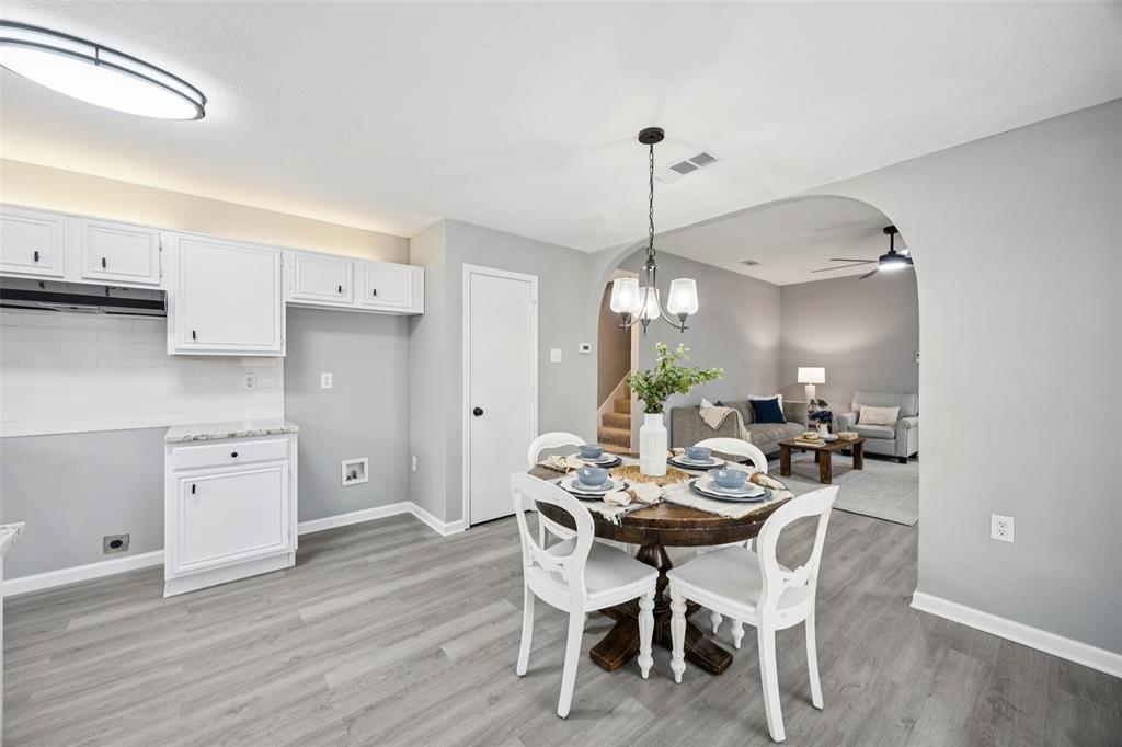 621 Renaissance Place Cedar Hill, TX 75104 - Photo 10 of 28 a view of a dining room with furniture and wooden floor