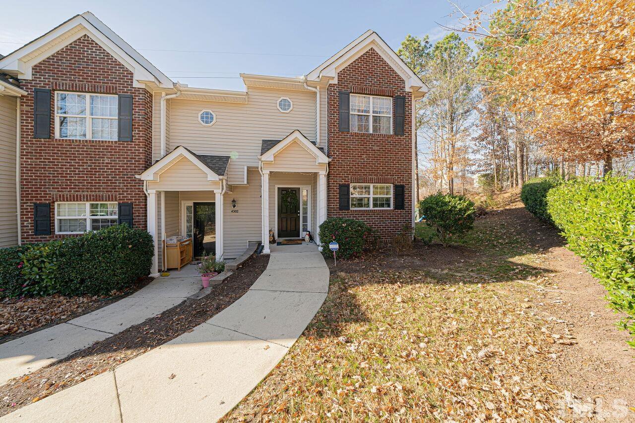 4500 Centrebrook Circle Raleigh, NC 27616 - Photo 2 of 39 a front view of a house with a yard