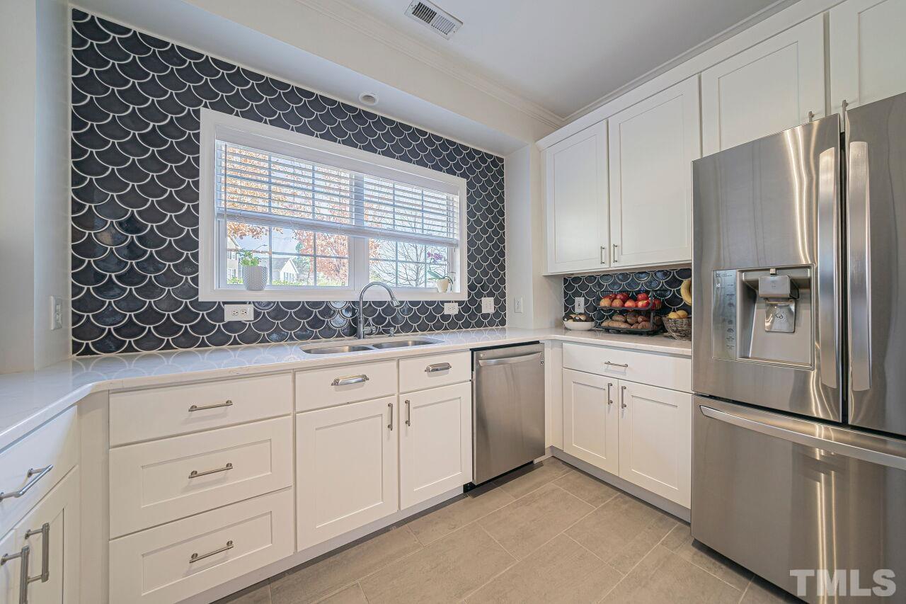 4500 Centrebrook Circle Raleigh, NC 27616 - Photo 11 of 39 a kitchen with granite countertop white cabinets and white appliances