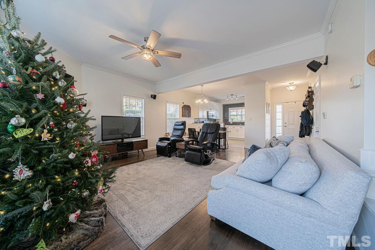4500 Centrebrook Circle Raleigh, NC 27616 - Photo 13 of 39 a living room with furniture a potted plant and a flat screen tv