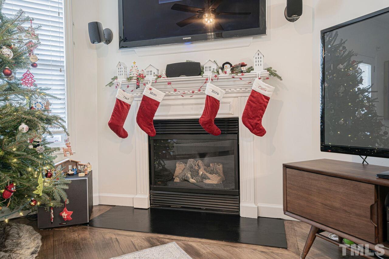 4500 Centrebrook Circle Raleigh, NC 27616 - Photo 14 of 39 a living room with furniture and a fireplace