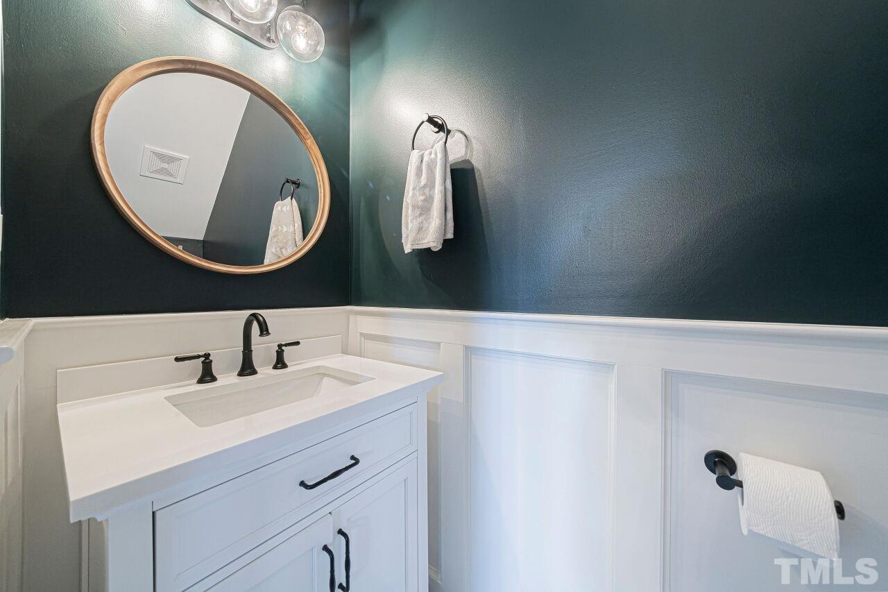 4500 Centrebrook Circle Raleigh, NC 27616 - Photo 16 of 39 a bathroom with a sink mirror and vanity