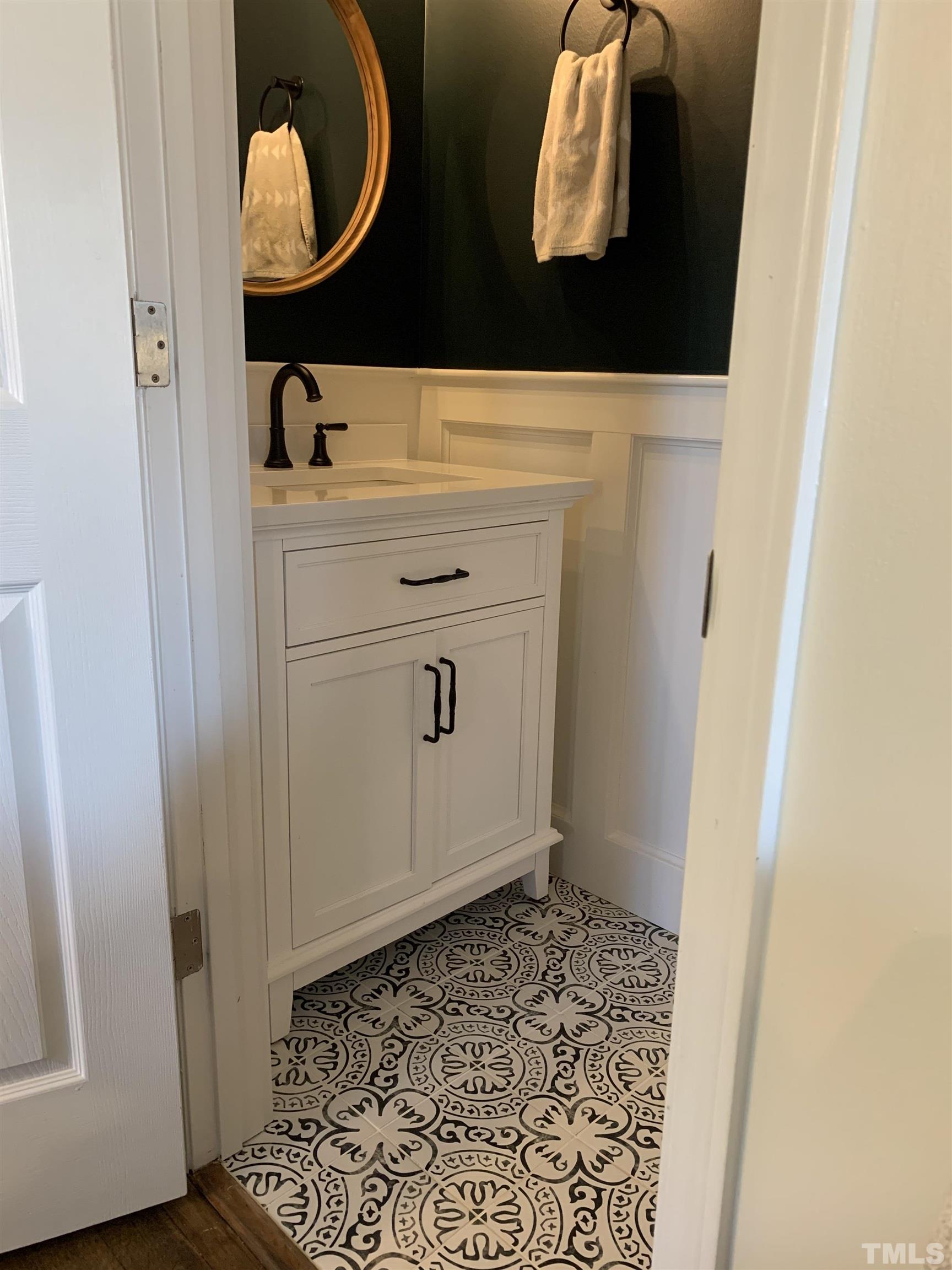 4500 Centrebrook Circle Raleigh, NC 27616 - Photo 17 of 39 a bathroom with a sink and a mirror