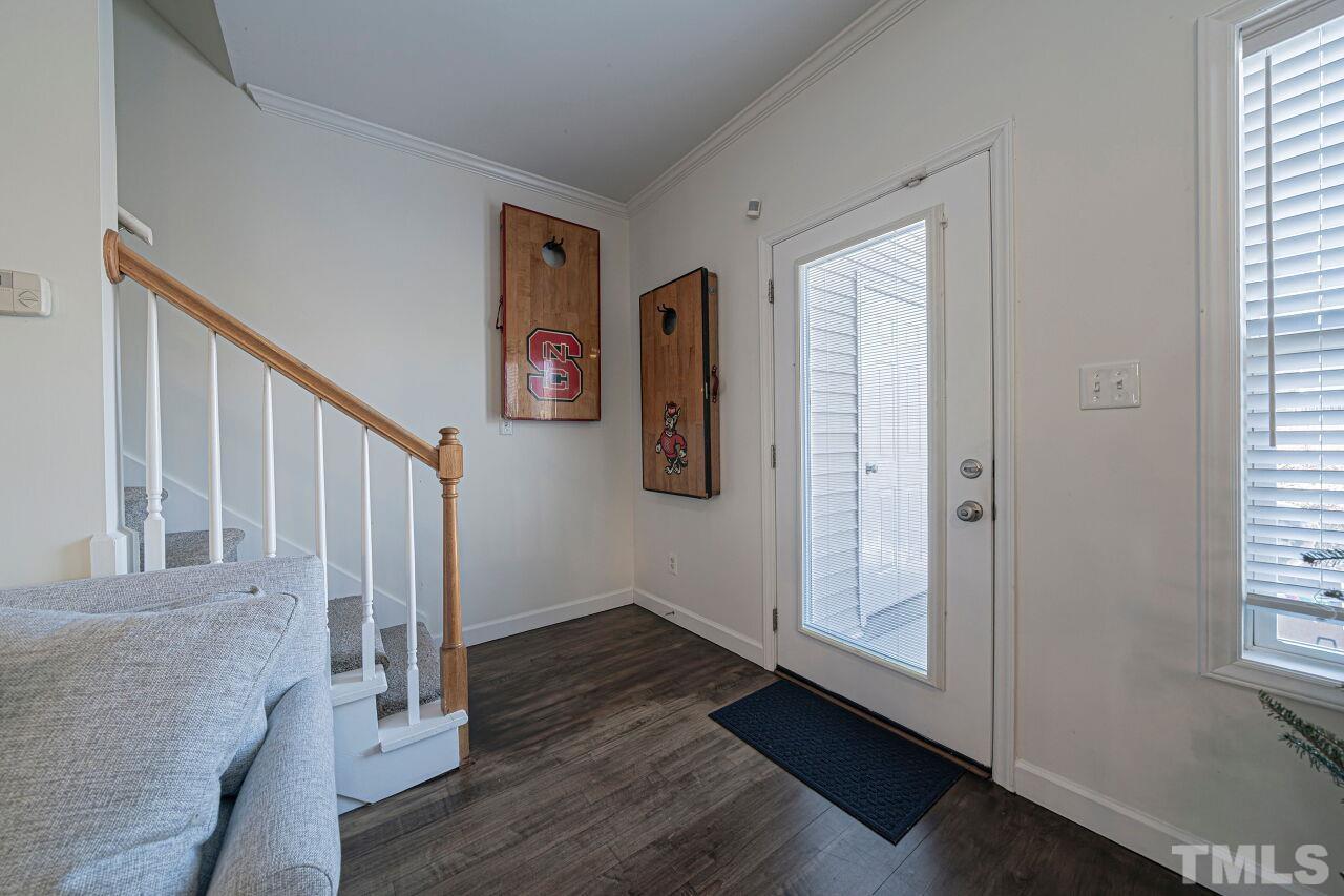 4500 Centrebrook Circle Raleigh, NC 27616 - Photo 20 of 39 a view of an entryway with wooden floor and windows