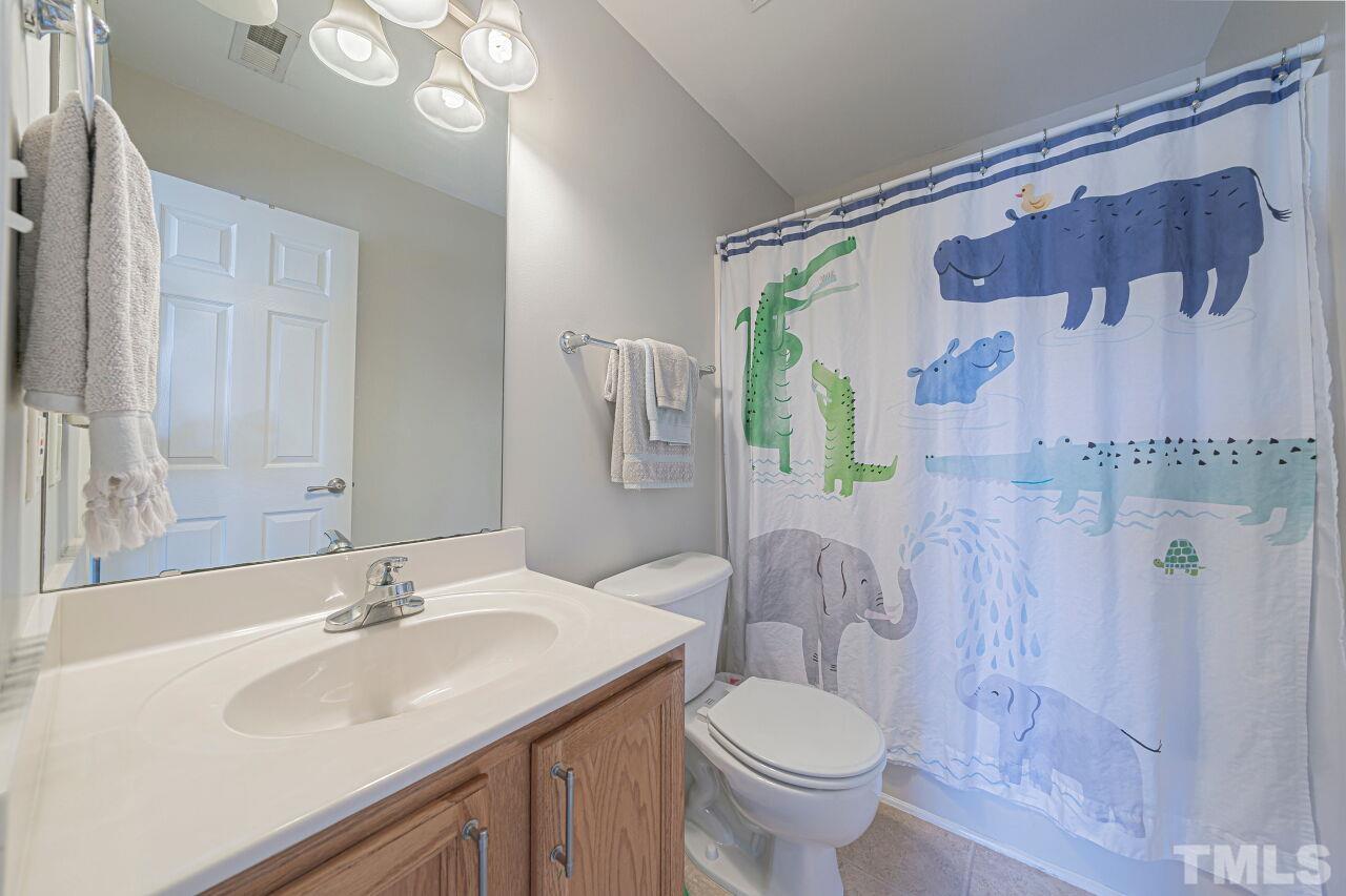 4500 Centrebrook Circle Raleigh, NC 27616 - Photo 33 of 39 a bathroom with a sink toilet and shower