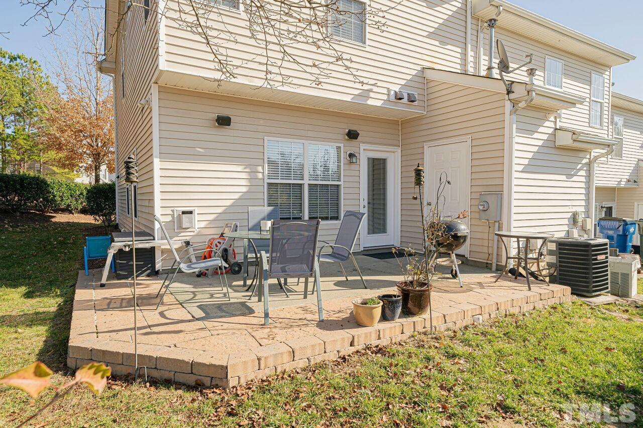 4500 Centrebrook Circle Raleigh, NC 27616 - Photo 36 of 39 a view of a patio with couches chairs and large trees