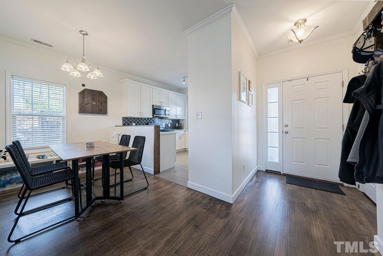 4500 Centrebrook Circle Raleigh, NC 27616 - Photo 5 of 39 a view of a dining room with furniture and wooden floor