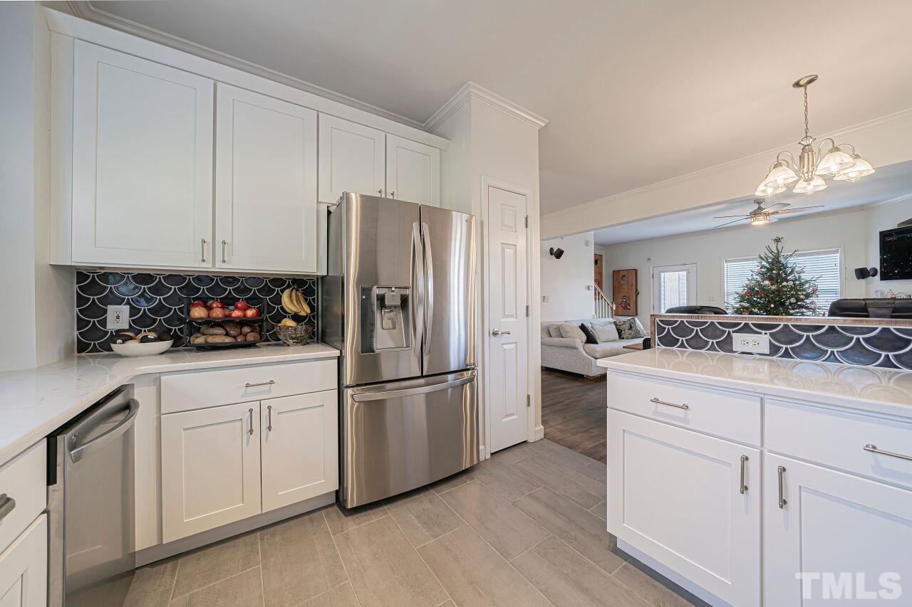 4500 Centrebrook Circle Raleigh, NC 27616 - Photo 10 of 39 a kitchen with white cabinets and refrigerator