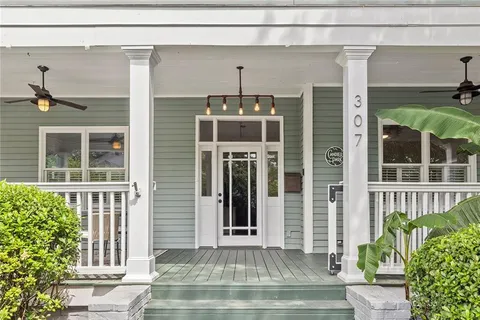 a front view of a house with a porch