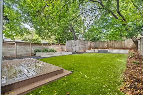 a view of a backyard with a small cabin