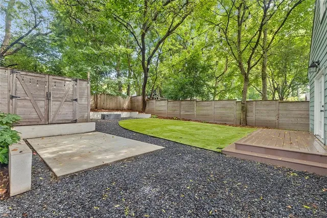 a view of backyard with green space