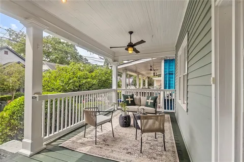 a view of a balcony with furniture