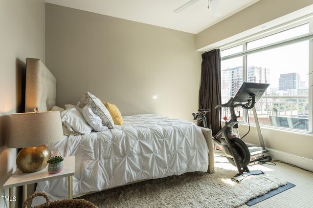 a bedroom with furniture and a window